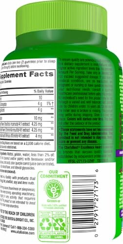 Green bottle of dietary supplement with label details.