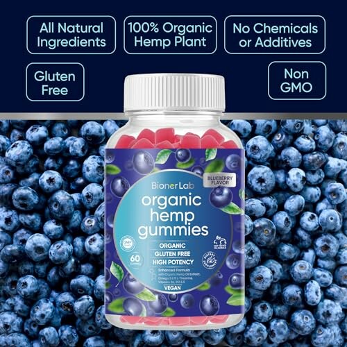 Bottle of organic hemp gummies with blueberry flavor surrounded by fresh blueberries.