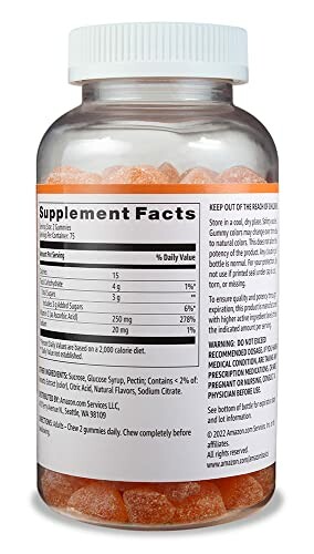 Bottle of vitamin gummies showing supplement facts label.